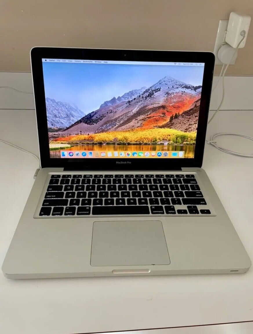 Apple MacBook Pro 13.5 (comes with everything. They\'re marks on back side & keyp