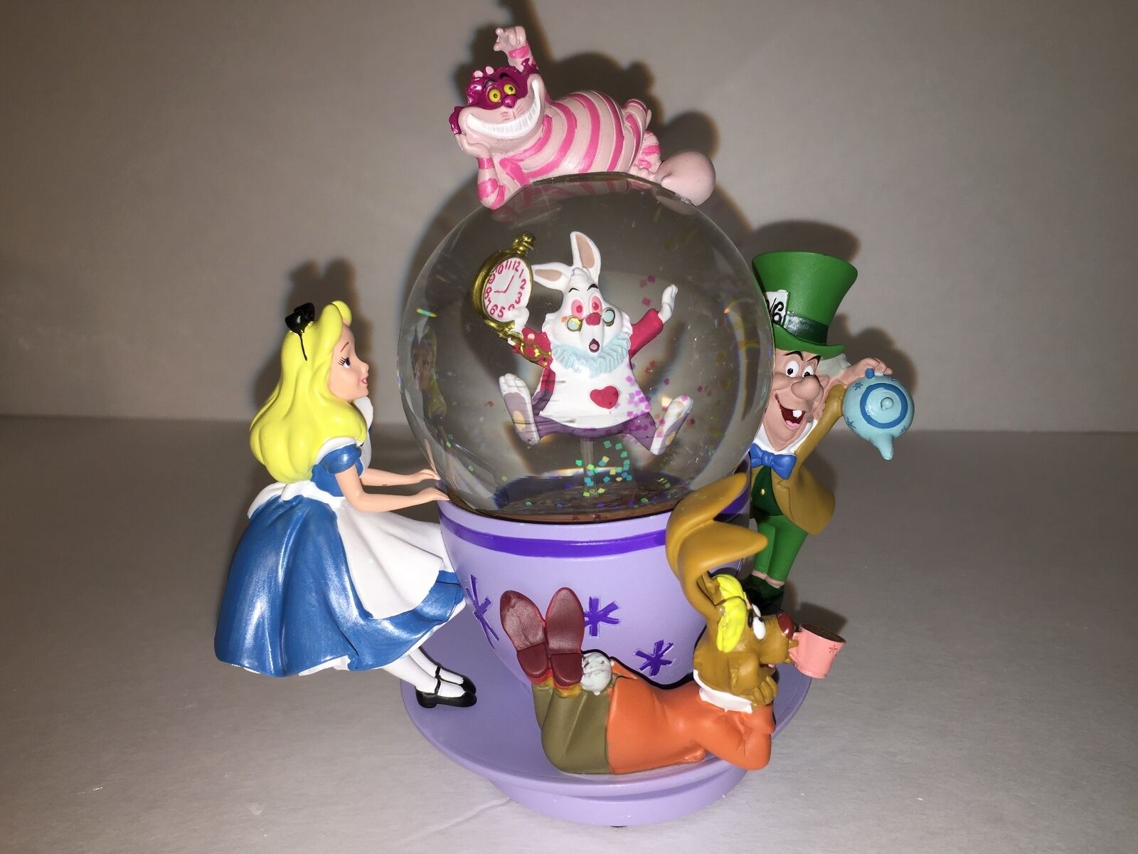 Disney Cheshire Cat Alice in Wonderland Spinning Tea Cup Snow Globe Mad Hatter