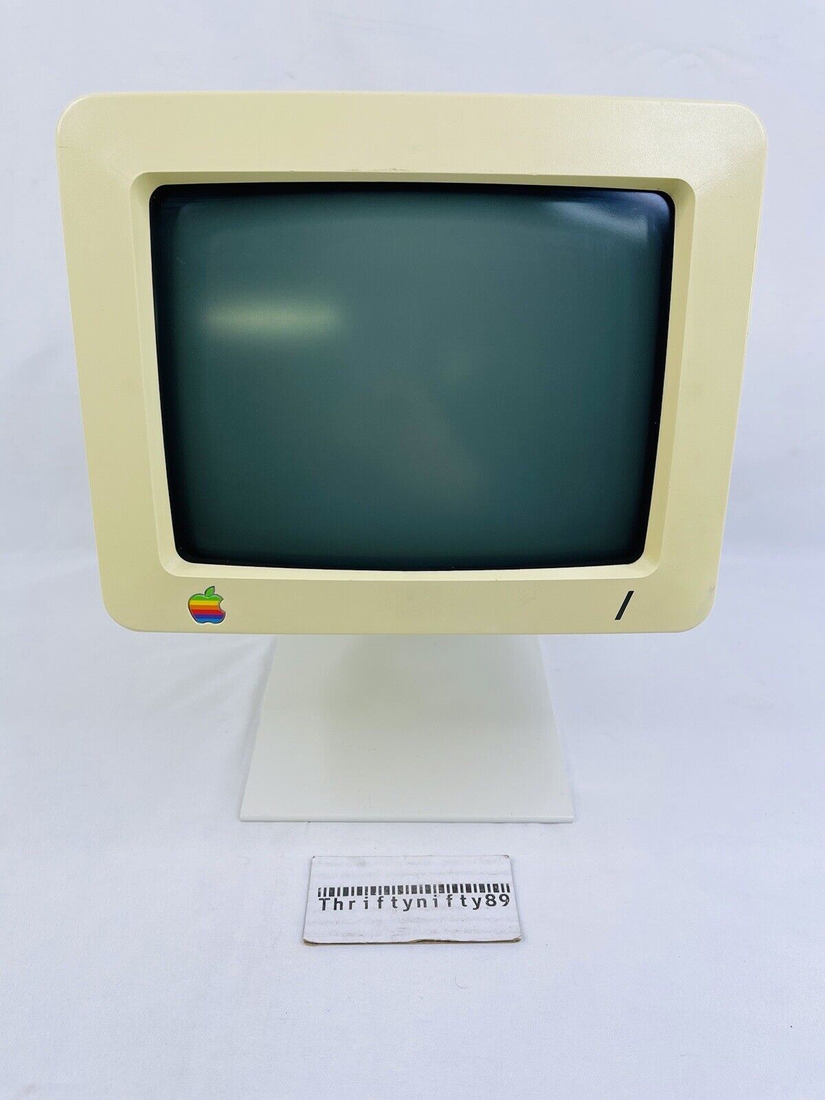 VINTAGE APPLE COMPUTER MONITOR MODEL G090H CRT  WITH APPLE STAND POWERS ON.
