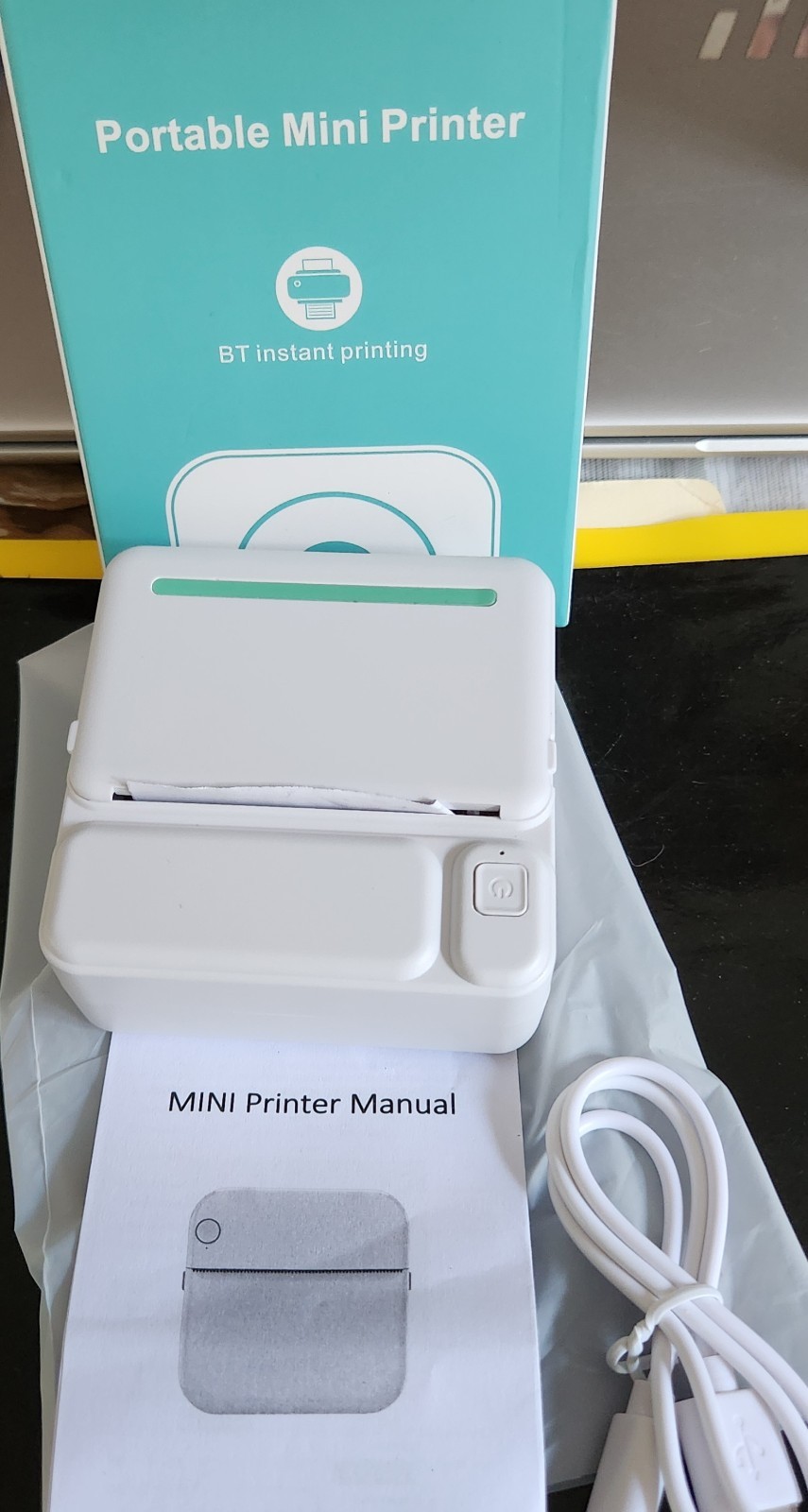 This item is a portable thermal mini printer designed for wireless bluetooth