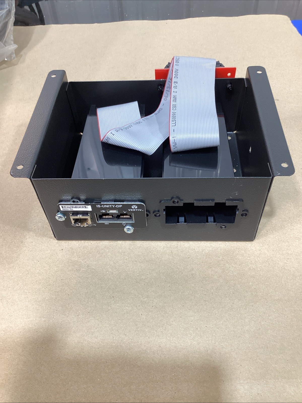 Vertiv IS-UNITY-DP Communications Card 417831G inside of an Emerson Intellislot