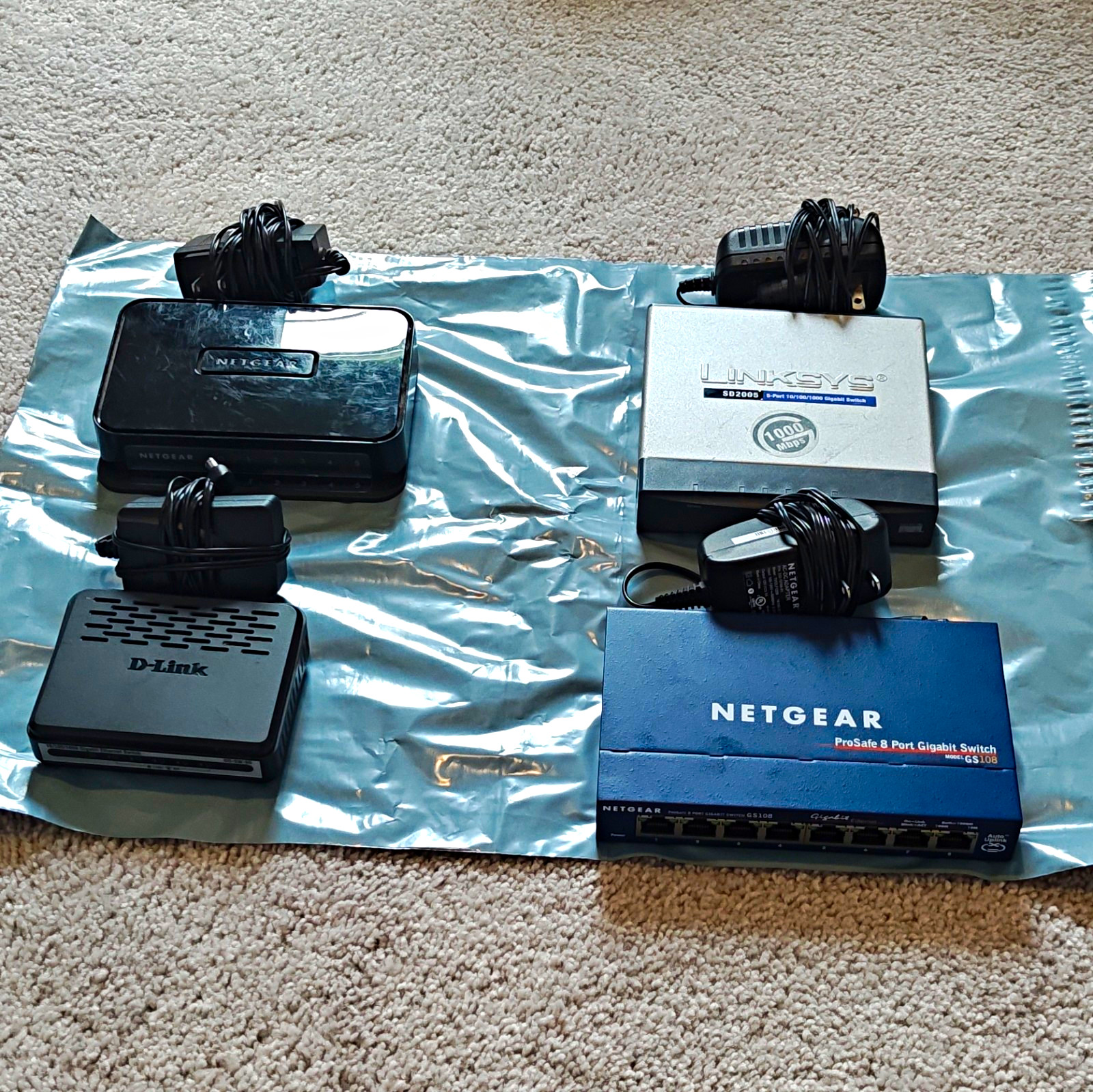 Lot Of Four (4) Gigabit Unmanaged Network Switches; Used - see description