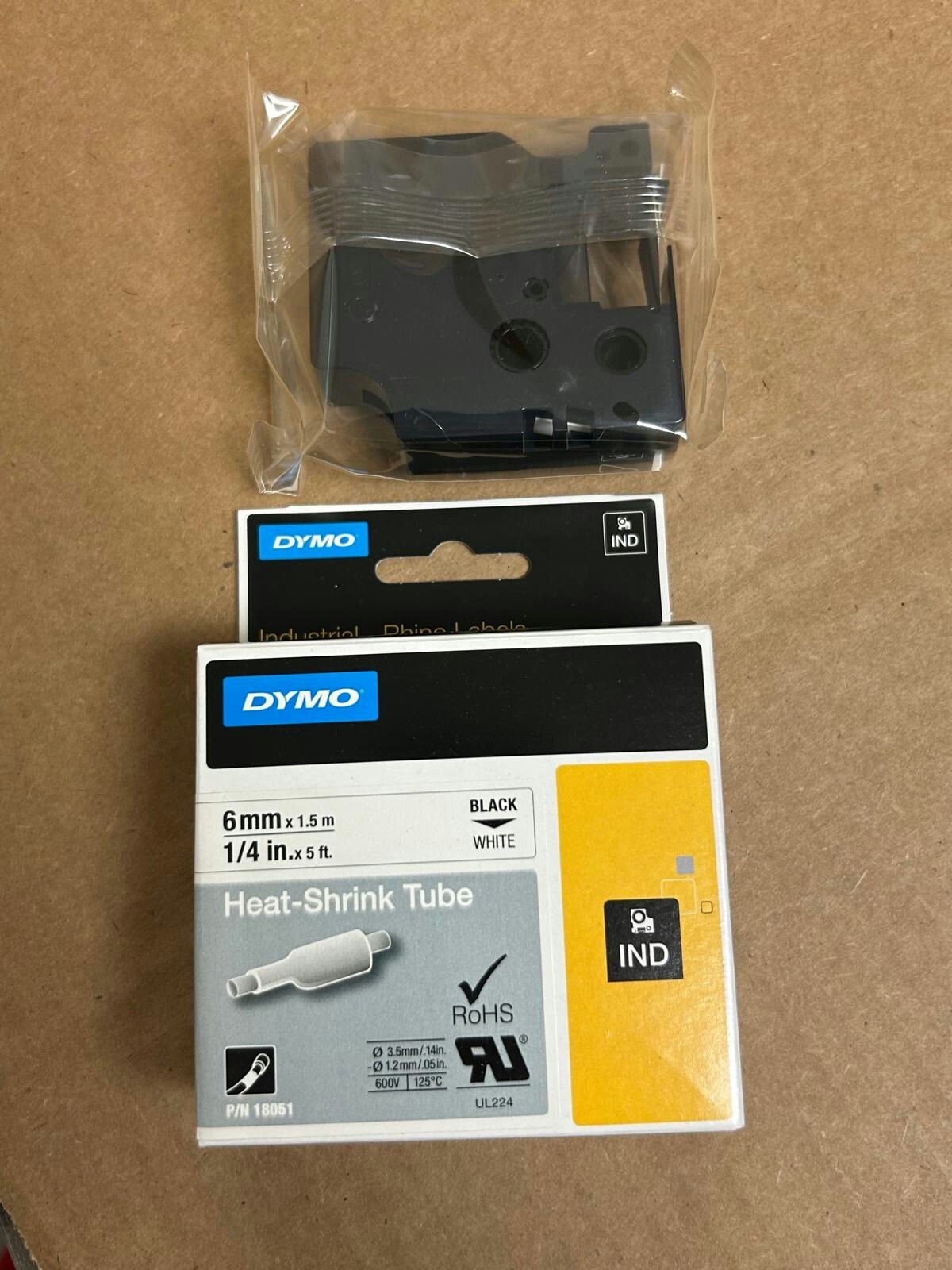 18051 DYMO RHINO WHITE HEAT SHRINK TUBING - 6MM, BLACK TEXT (P/N: 18051)