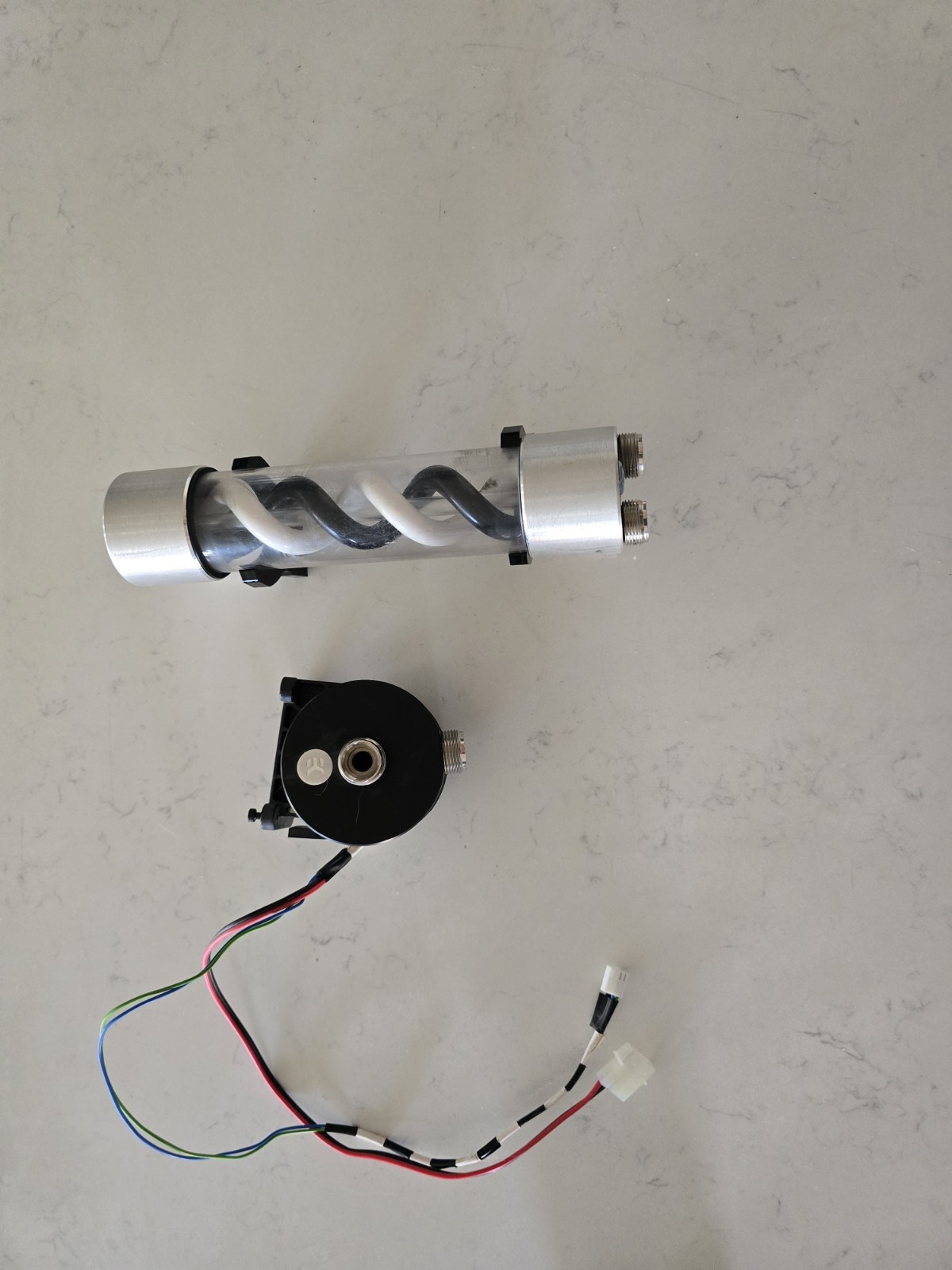 EK Waterblock Pump And Helix Reservoir.
