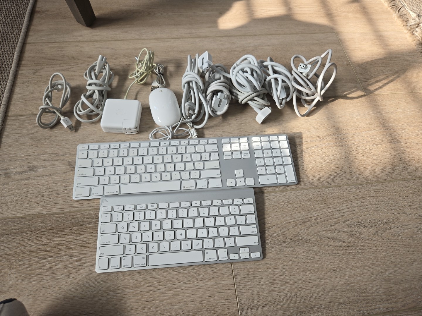 Lot of Apple Products; Keyboards, Mouse, Cords, Powersupply. 