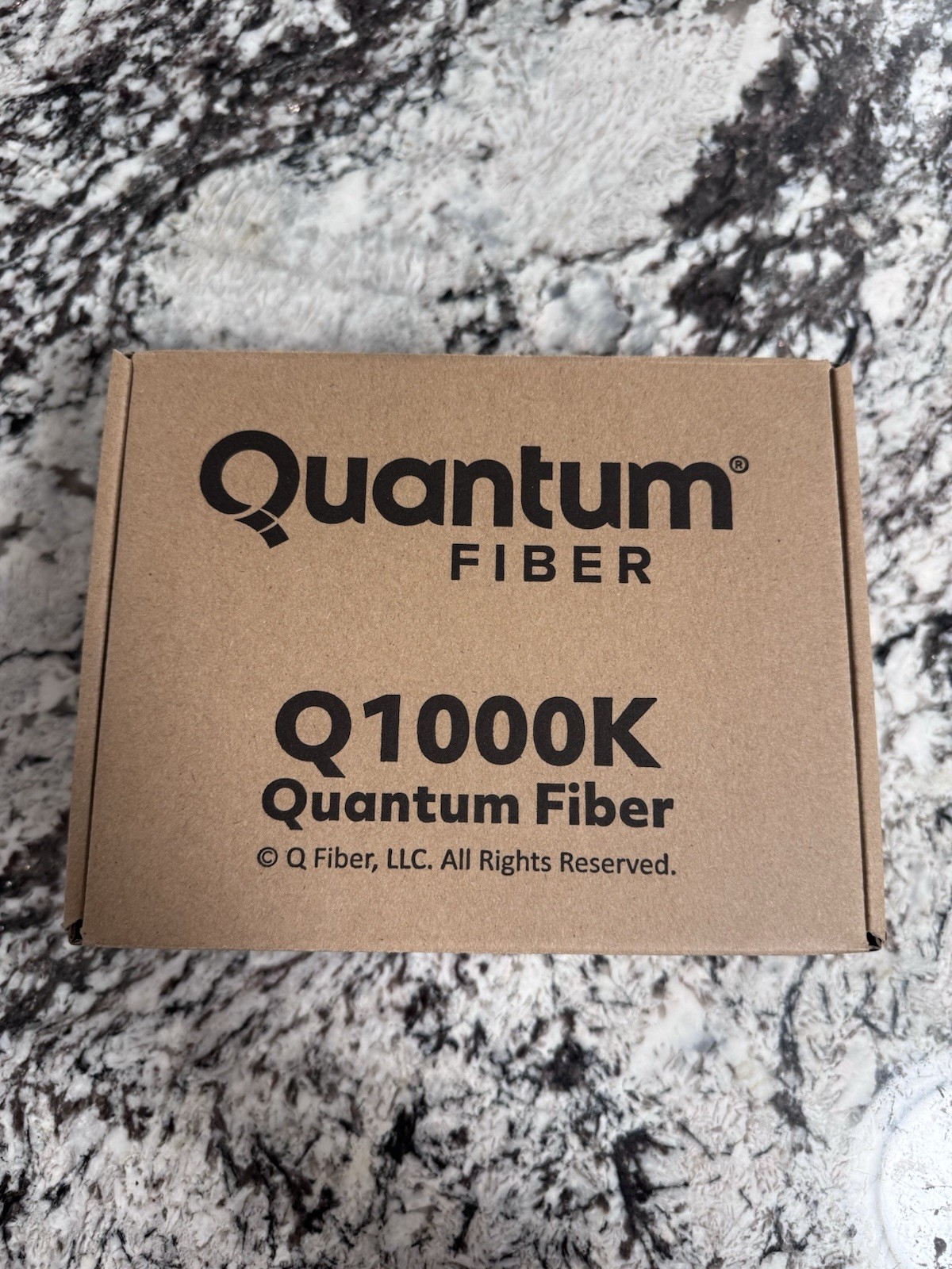NEW QUANTUM FIBER INTERNET Q1000K SMARTNID MODEM W/ WALL FIBER SPOOL BRACKET NIB