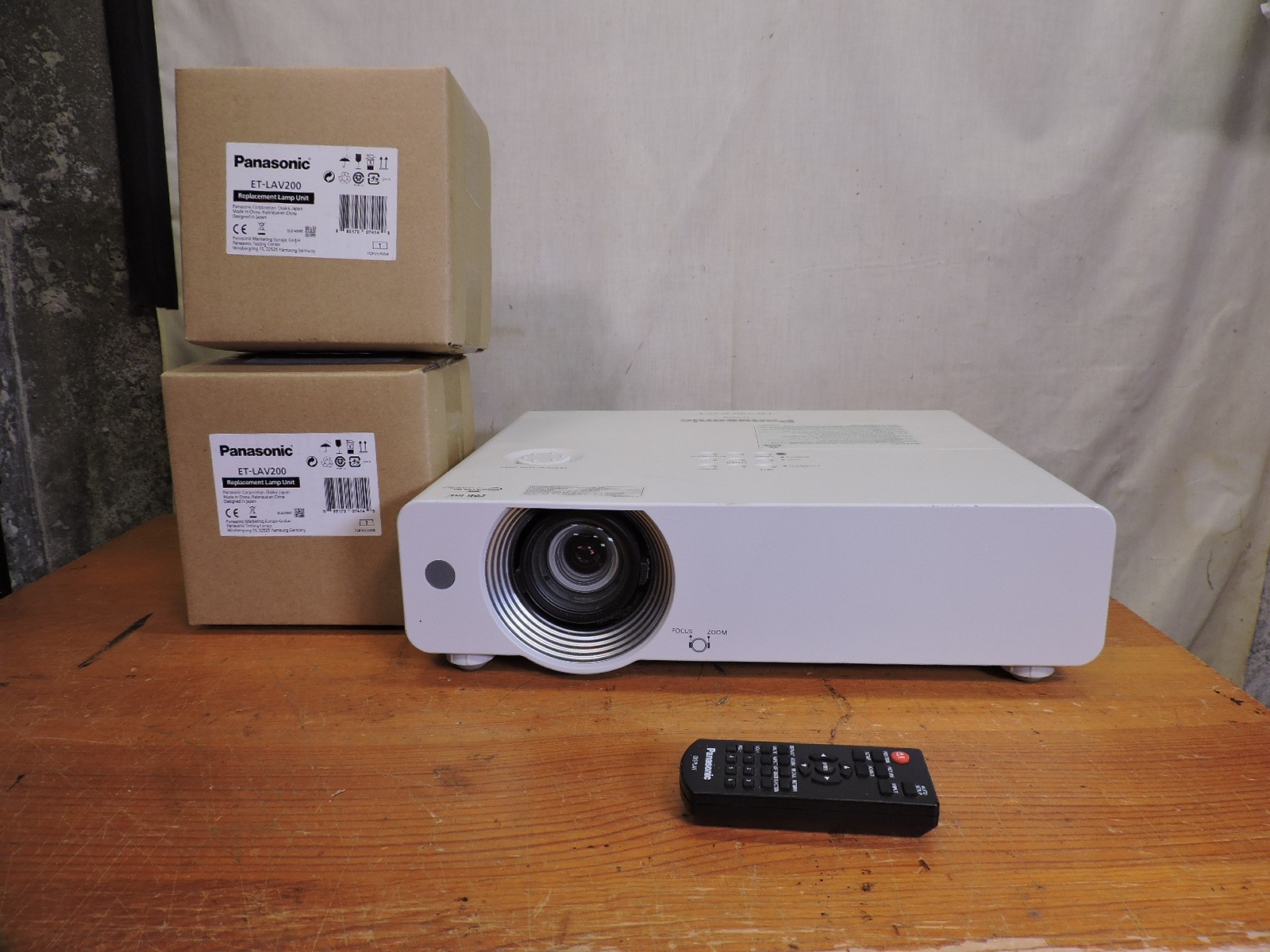 Panasonic PT-VW440U projector 4800 Lumen projector 2 spare lamps and the remote.