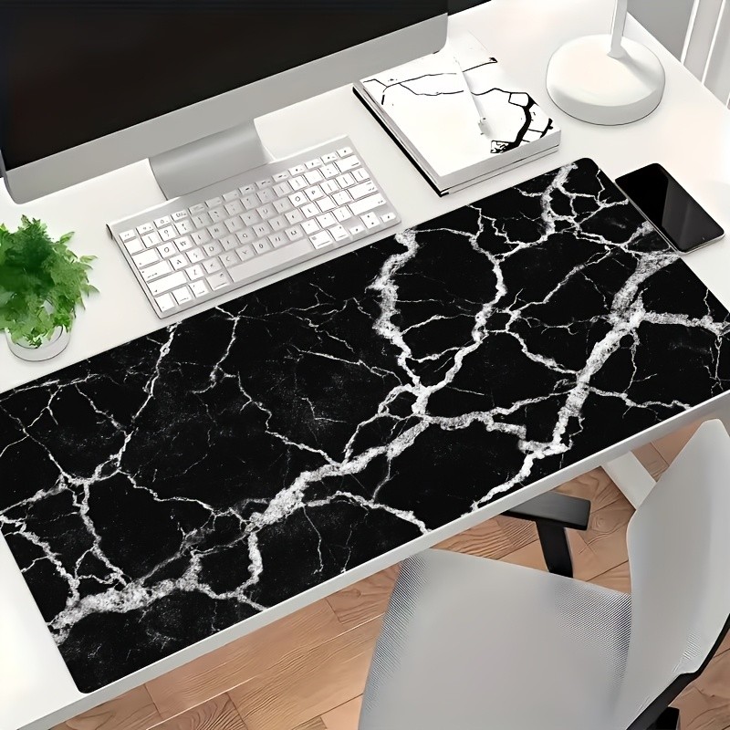 A Large Black And White Marbled Gaming Mouse Pad with a Decorative Pattern, Pe