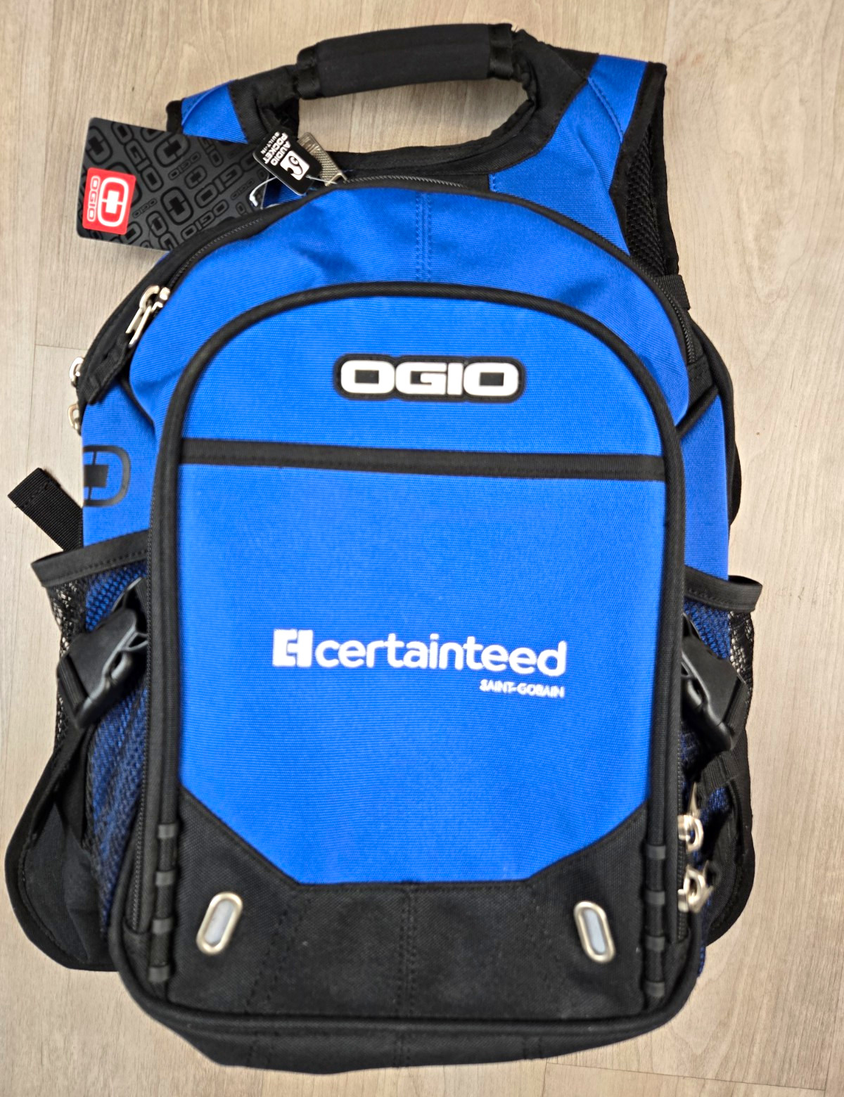 ​NWT OGIO Fugitive Backpack Blue Black Laptop Audio Port Bag CertainTeed Logo