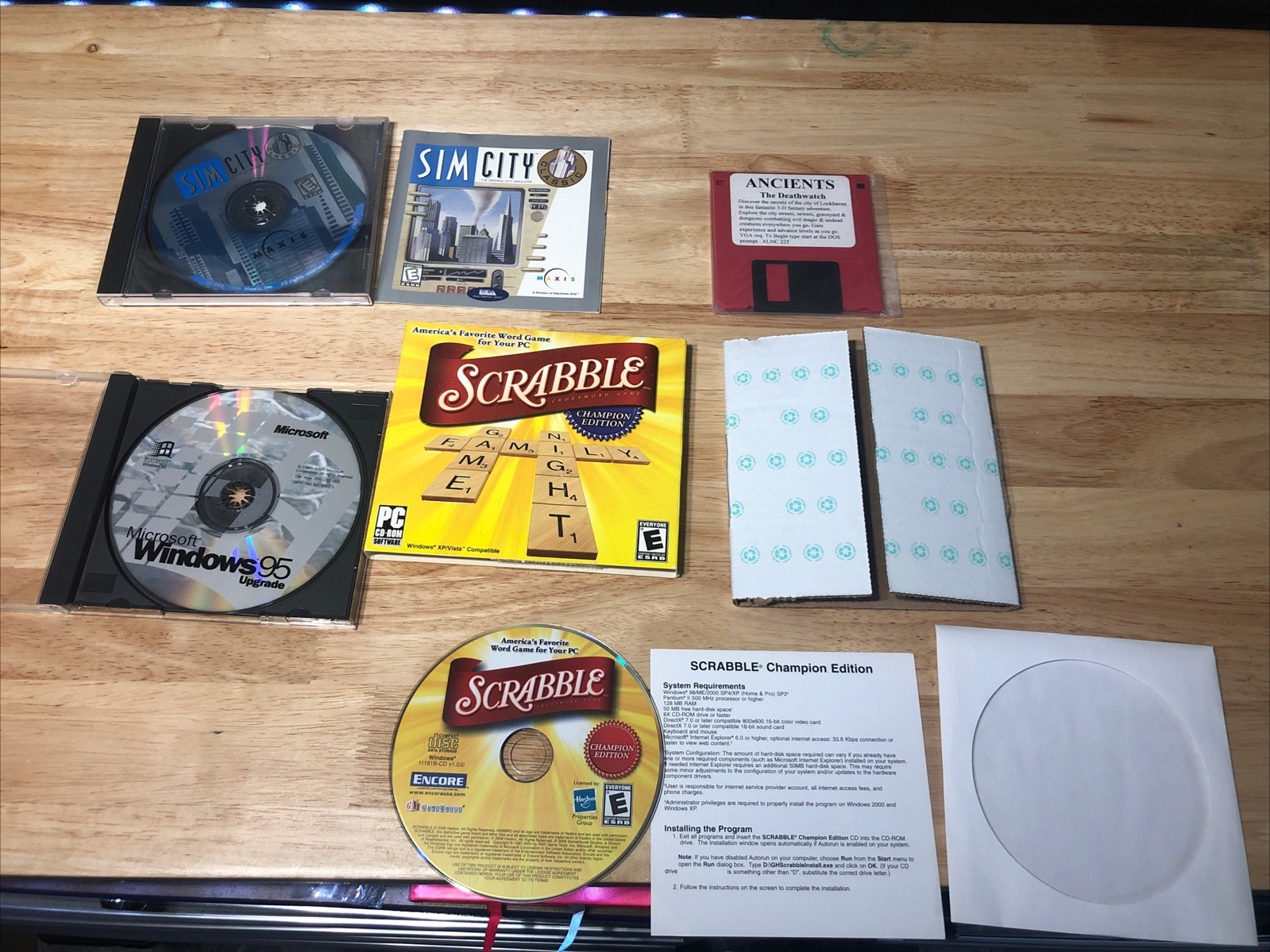 90s Windows 95 disc, Sim City CD Rom, scrabble champion, Ancients Deathwatch