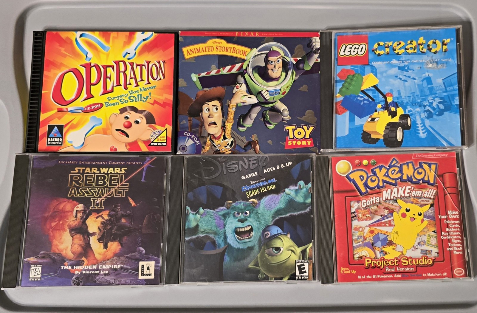 LOT of 10 PC/Mac CD Games LEGO Creator, Toy Story, Pokemon, Putt-Putt, Star Wars