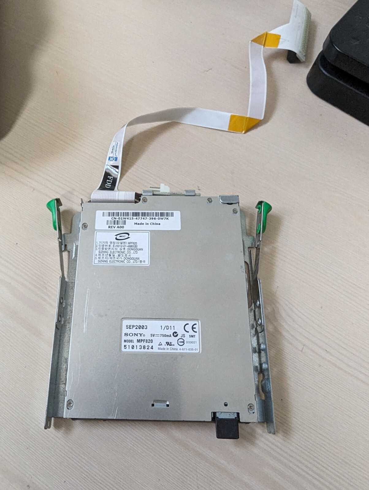 Various slim 1.44 3.25 floppy drives with ribbon cables and bracket No faceplate