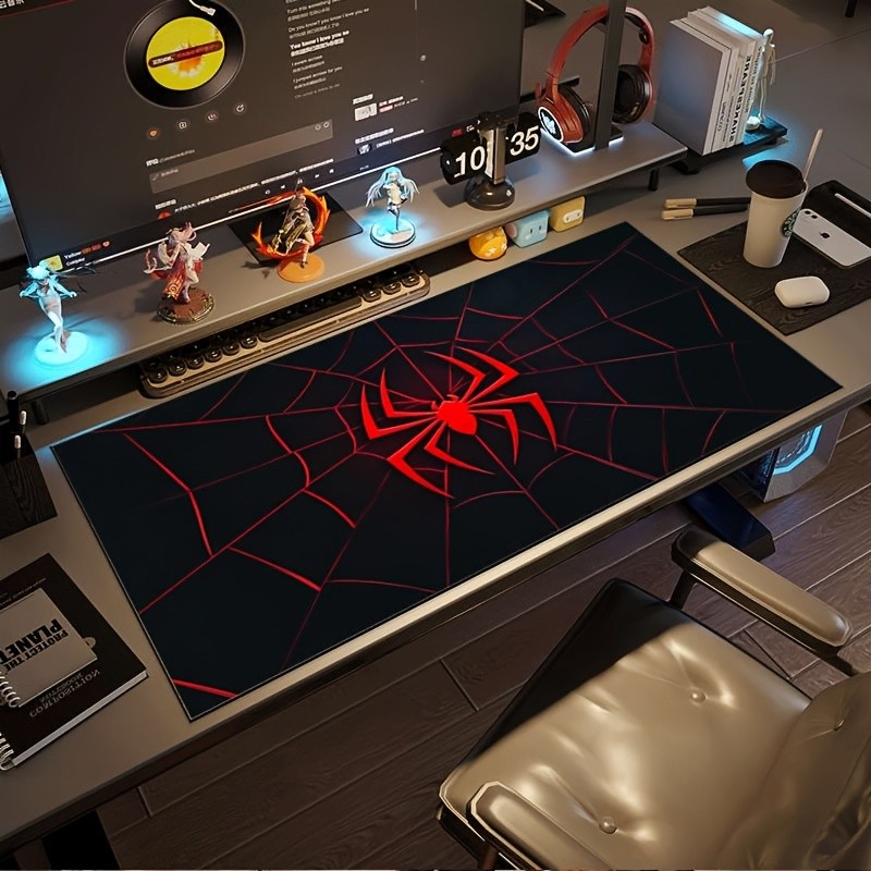 A Large Gaming Mouse Pad Featuring a Red And Black Spider Web Design with a Sp