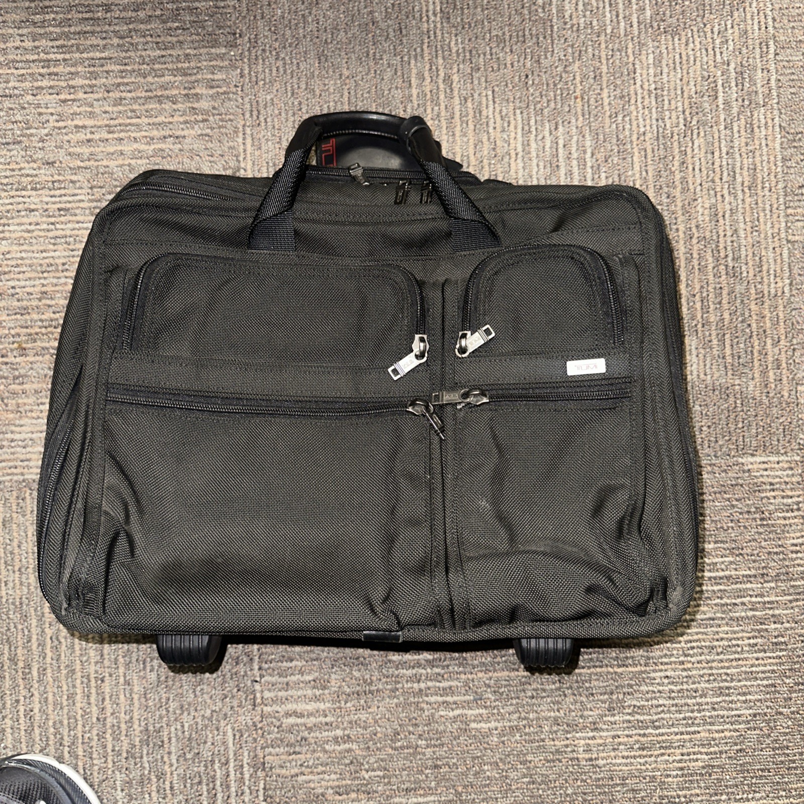Tumi Alpha series wheeled briefcase