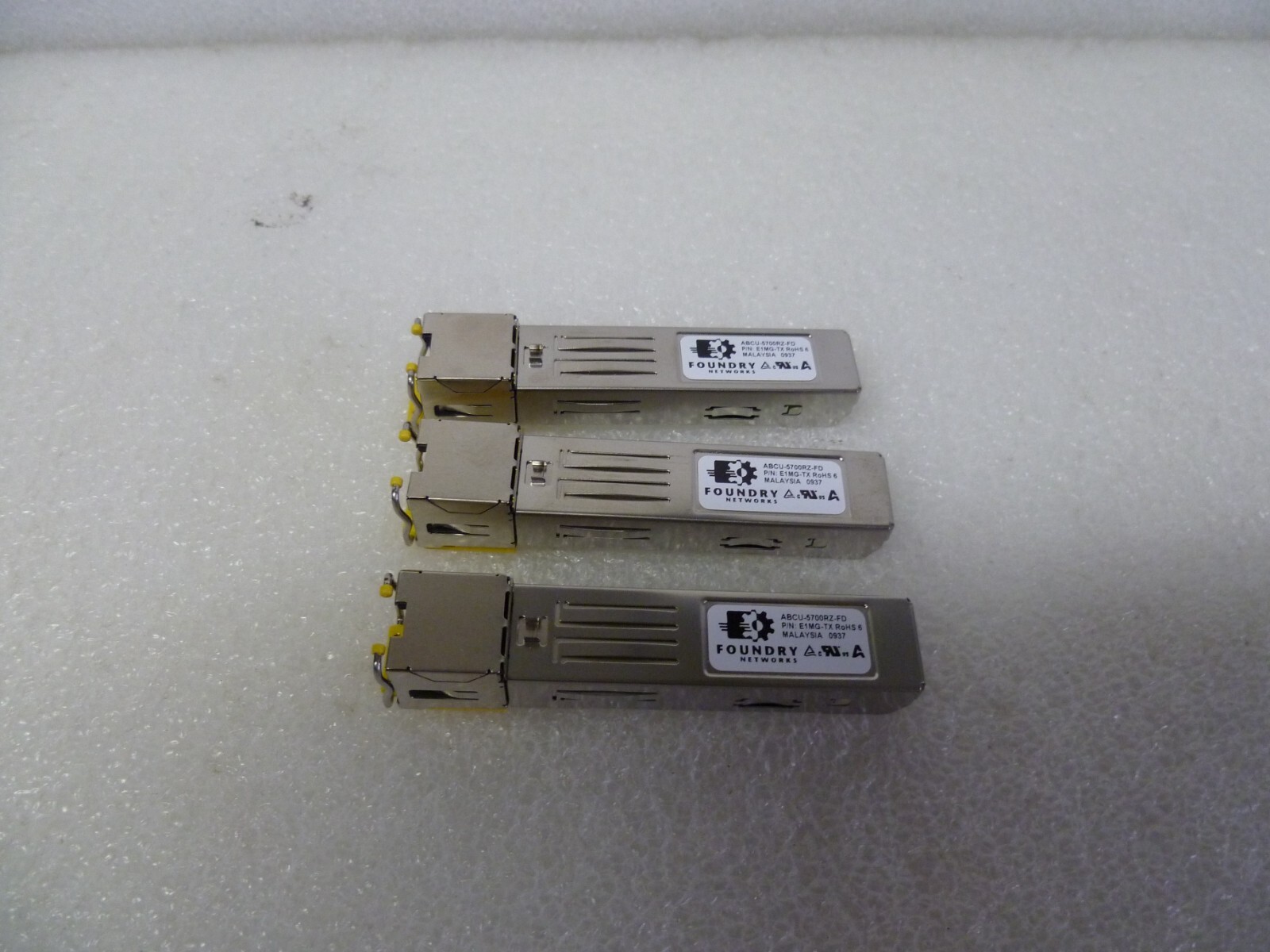 LOT OF 3 Foundry ABCU-5700RZ-FD Gigabit 1000BASE-TX RJ45 E1MG-TX SFP MODULE