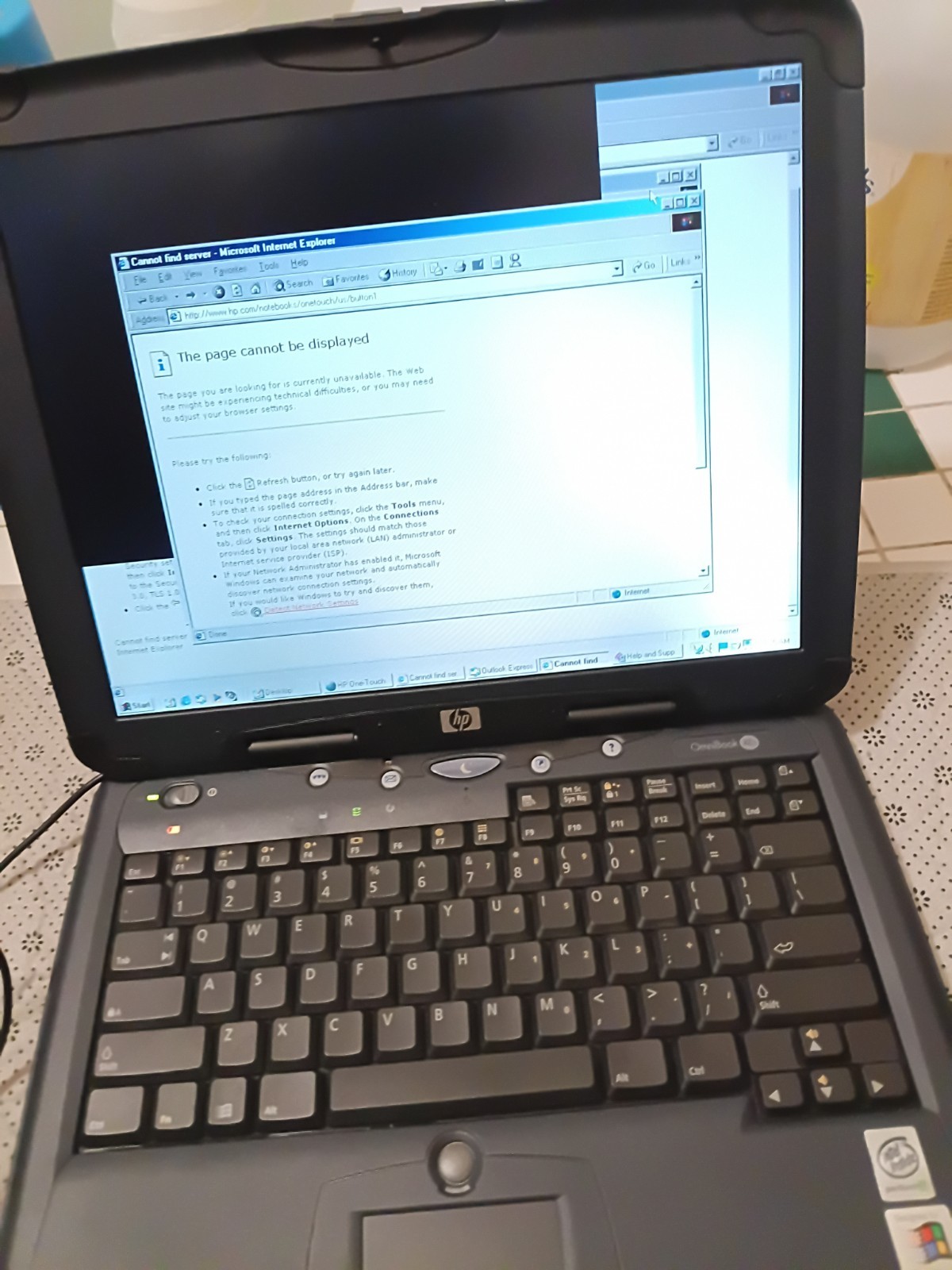 HP laptop, with Windows XP, DVD slot built in on side. Its