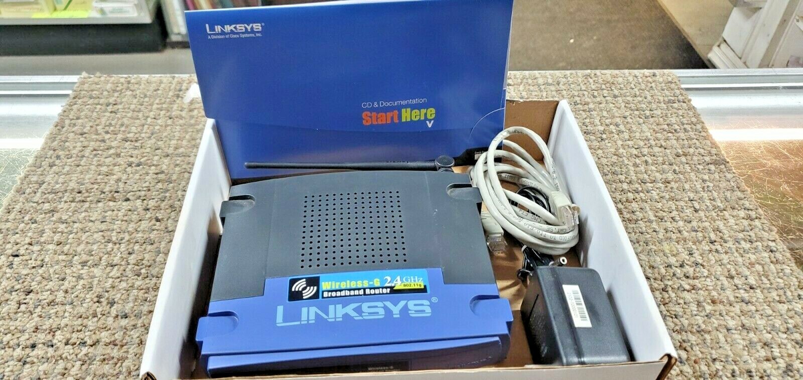 Linksys WRK54G 54 Mbps 4-Port 10/100 Wireless G Router (FC65-2-G798)