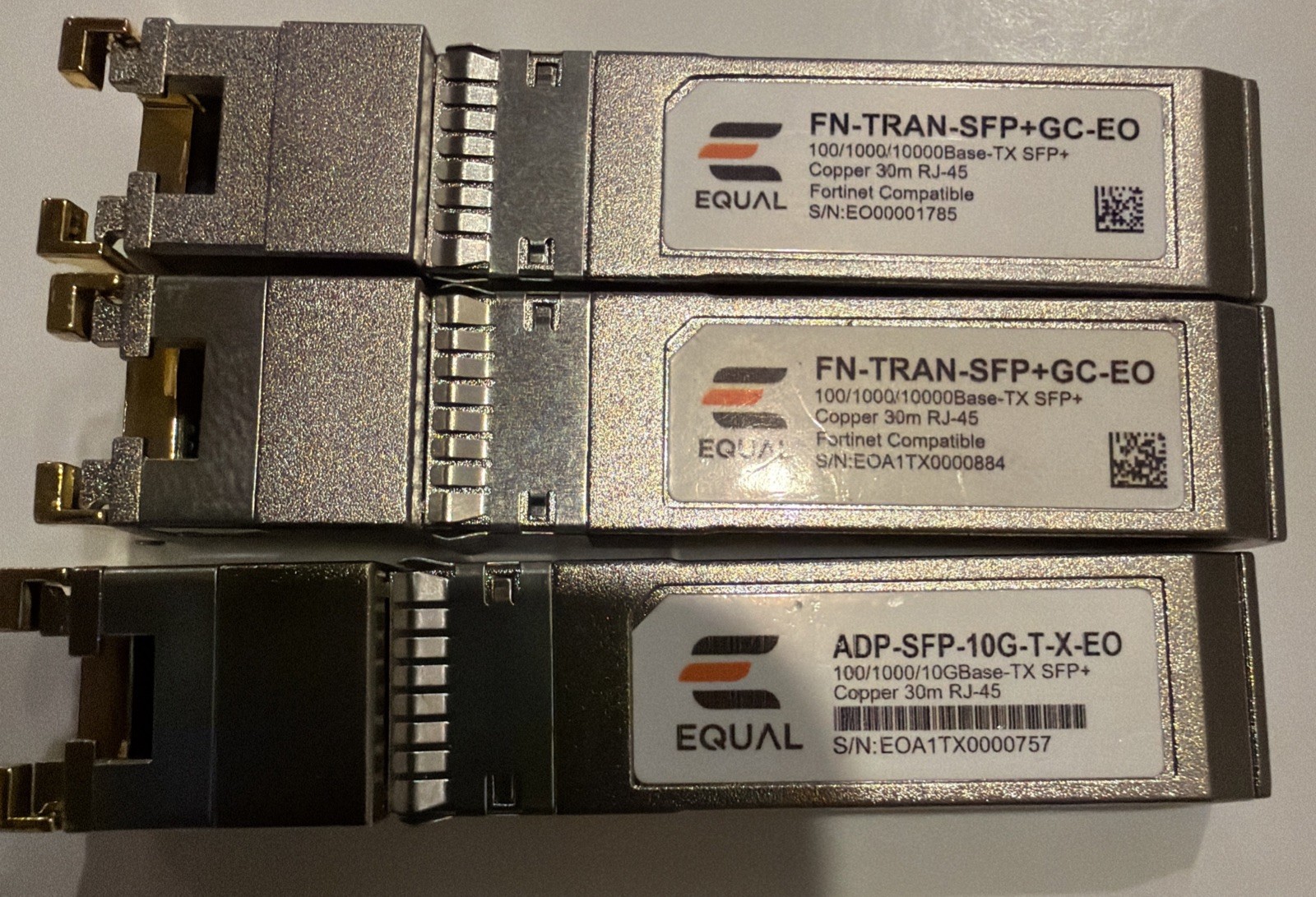 Lot Of 2x Equal FG-TRAN-SFP+GC-EO, 1x ADP-SFP+10G-T-X-EO