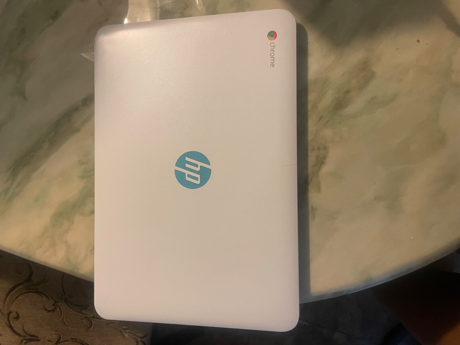 White & Blue HP Chrome laptop computer 