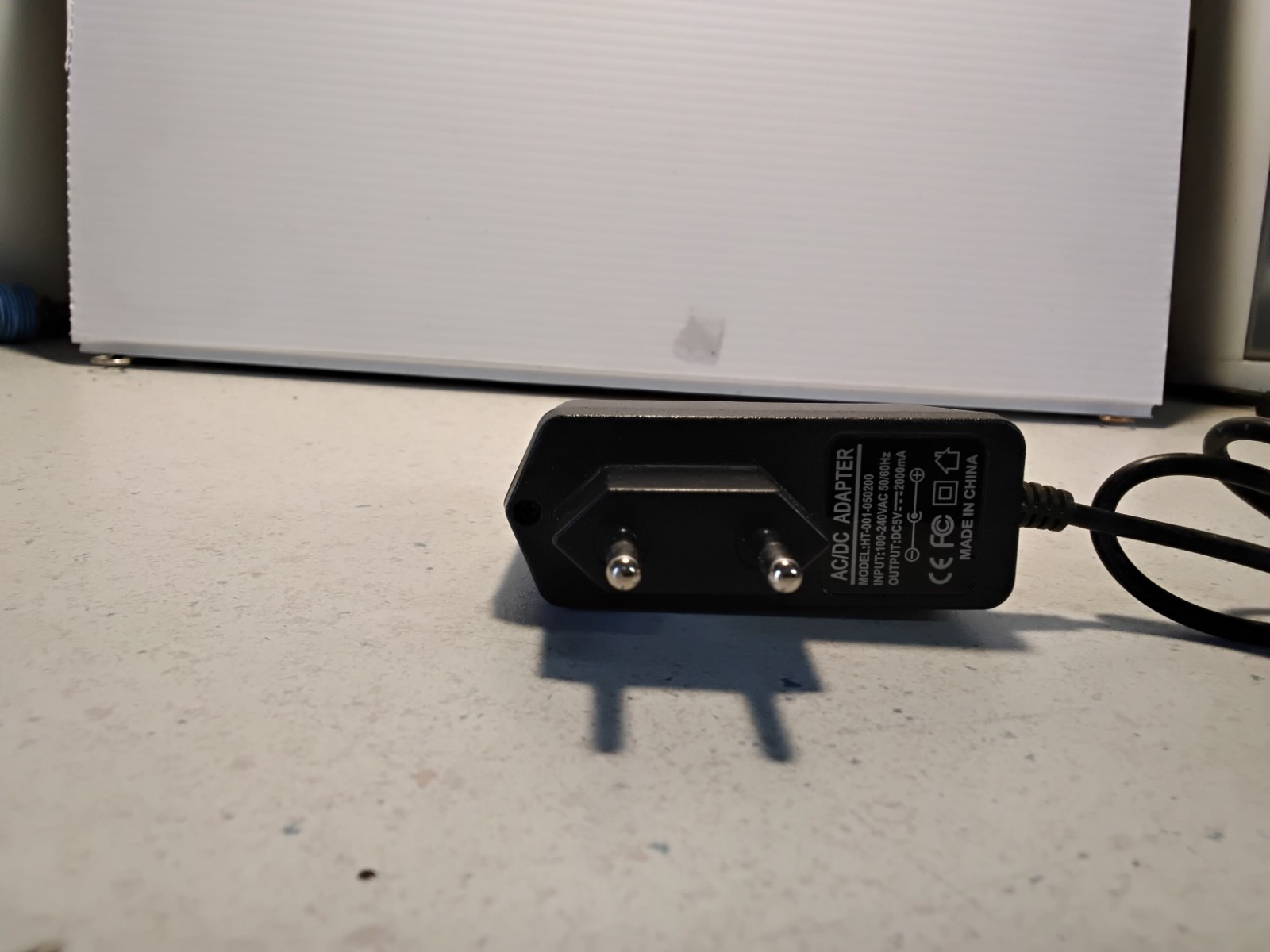 AC/DC ADAPTER MODEL: HT-001-050200 CHARGER INPUT:100-240 / OUTPUT:DC5V