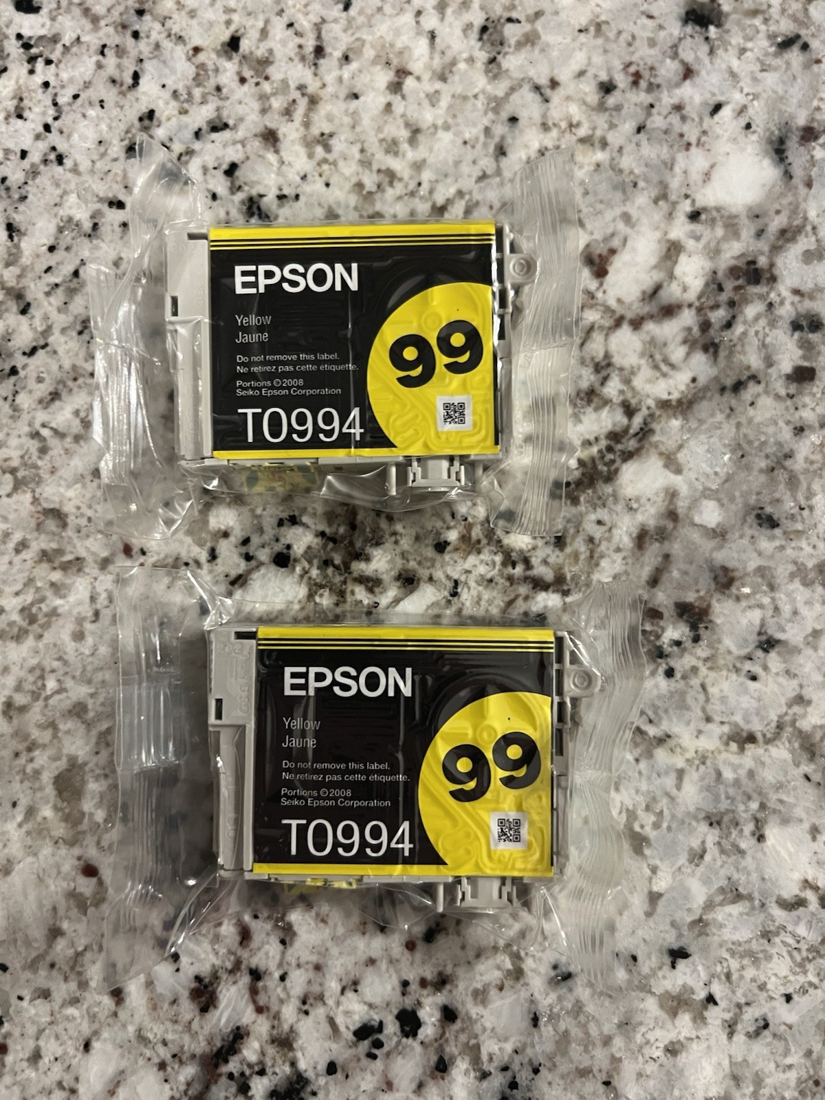 two genuine Epson T0994 yellow ink cartridges.