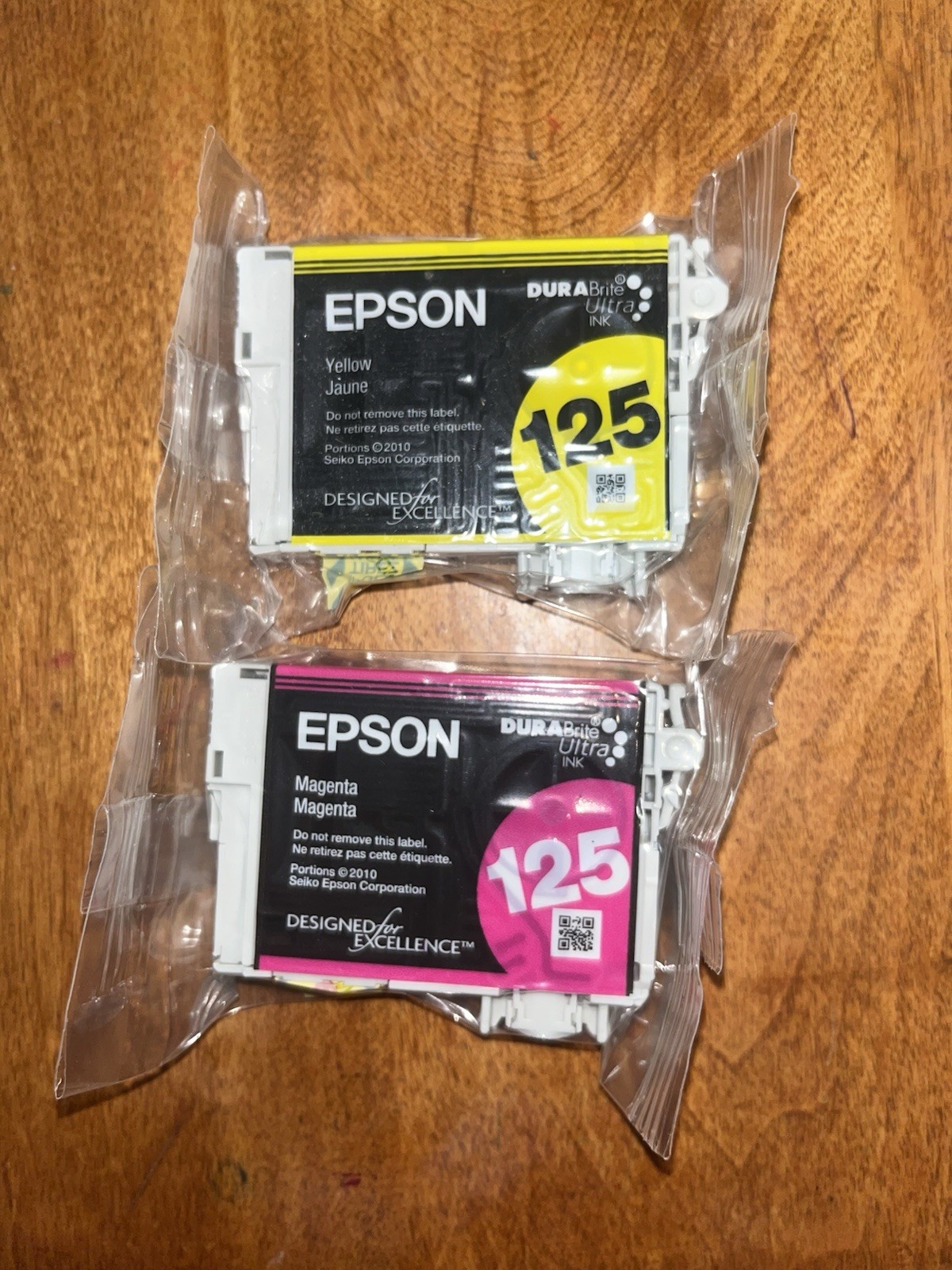 Two sealed Epson 125 DuraBrite Ultra ink cartridges in yellow and magenta