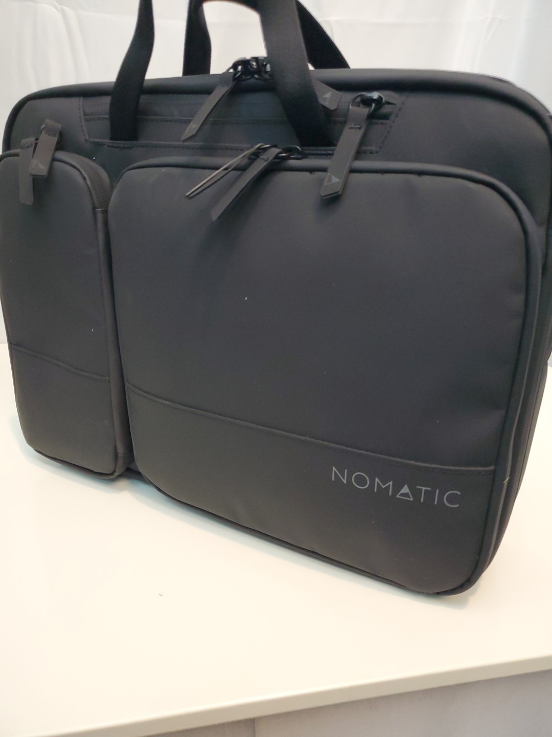 Nomatic 11L laptop Bag, Expands to 13.5L, Fits 16" Laptops, RFID, MSRP:  $169.99