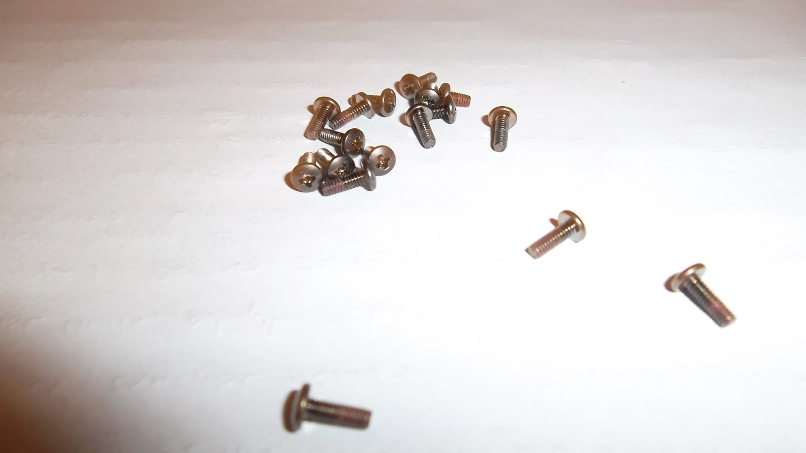Used pack of 17 miscellaneous case screws from toshiba dvd dock. Look