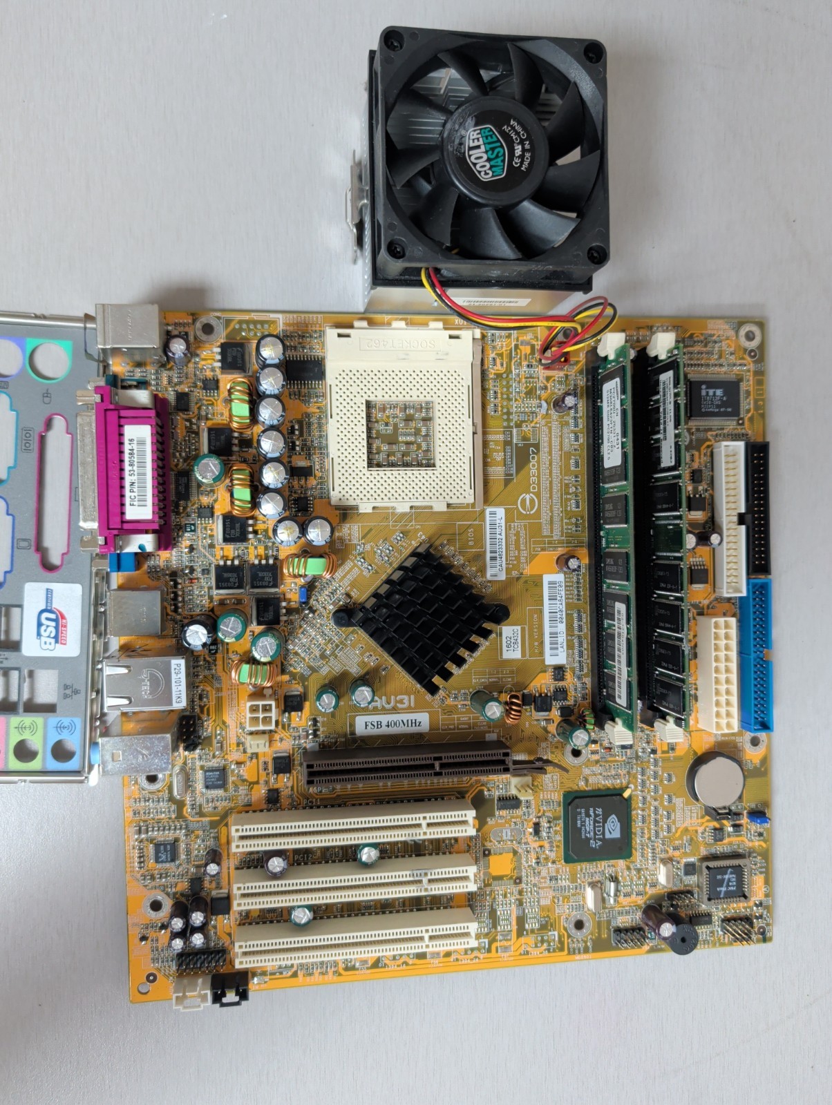 FIC AU31 AU31-L Motherboard W/ 1 GB Ram, I/O Shield And Heatsink/Fan See Pics
