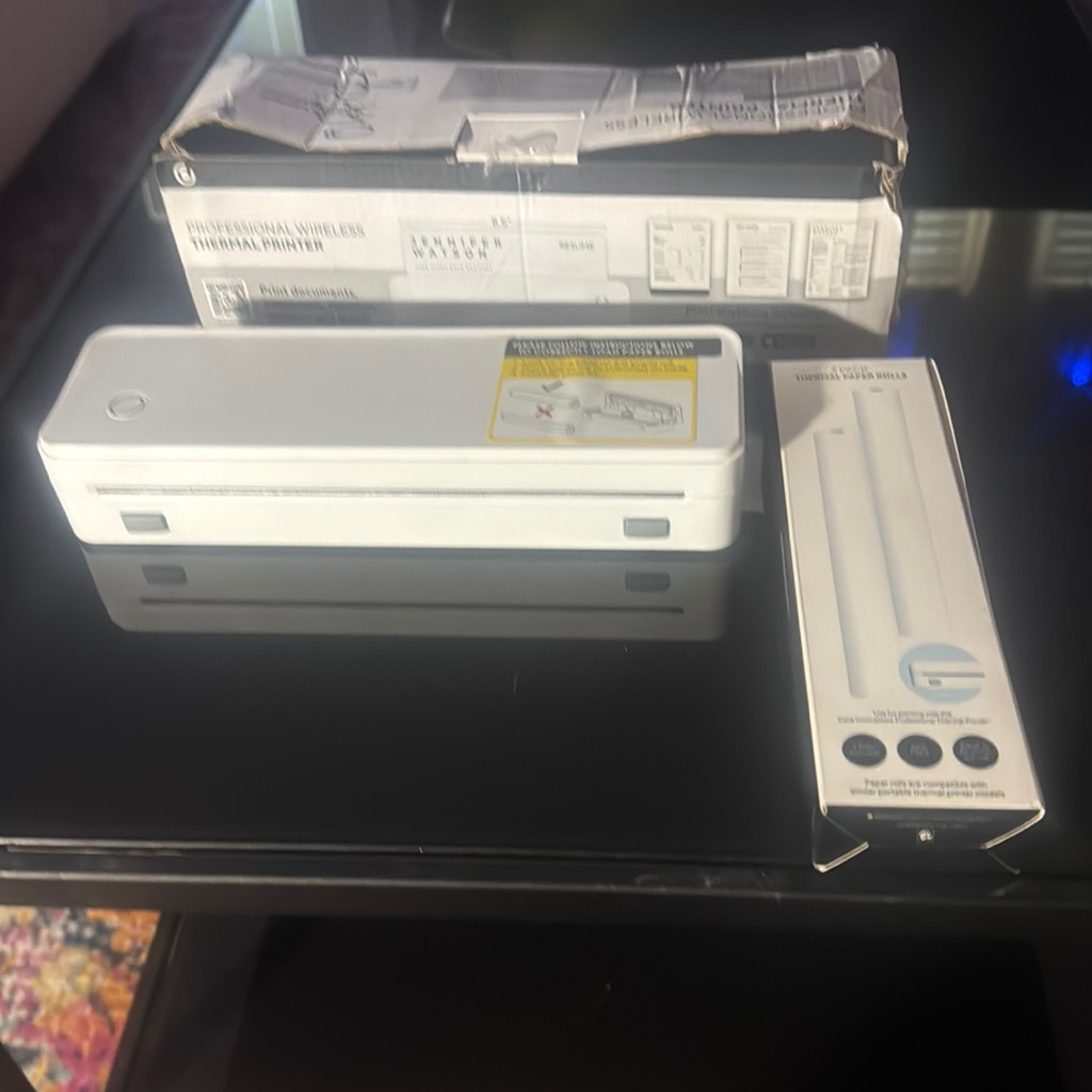 Open Box Core Innovation WL Thermal Printer  & 2 pack of thermal paper rolls.