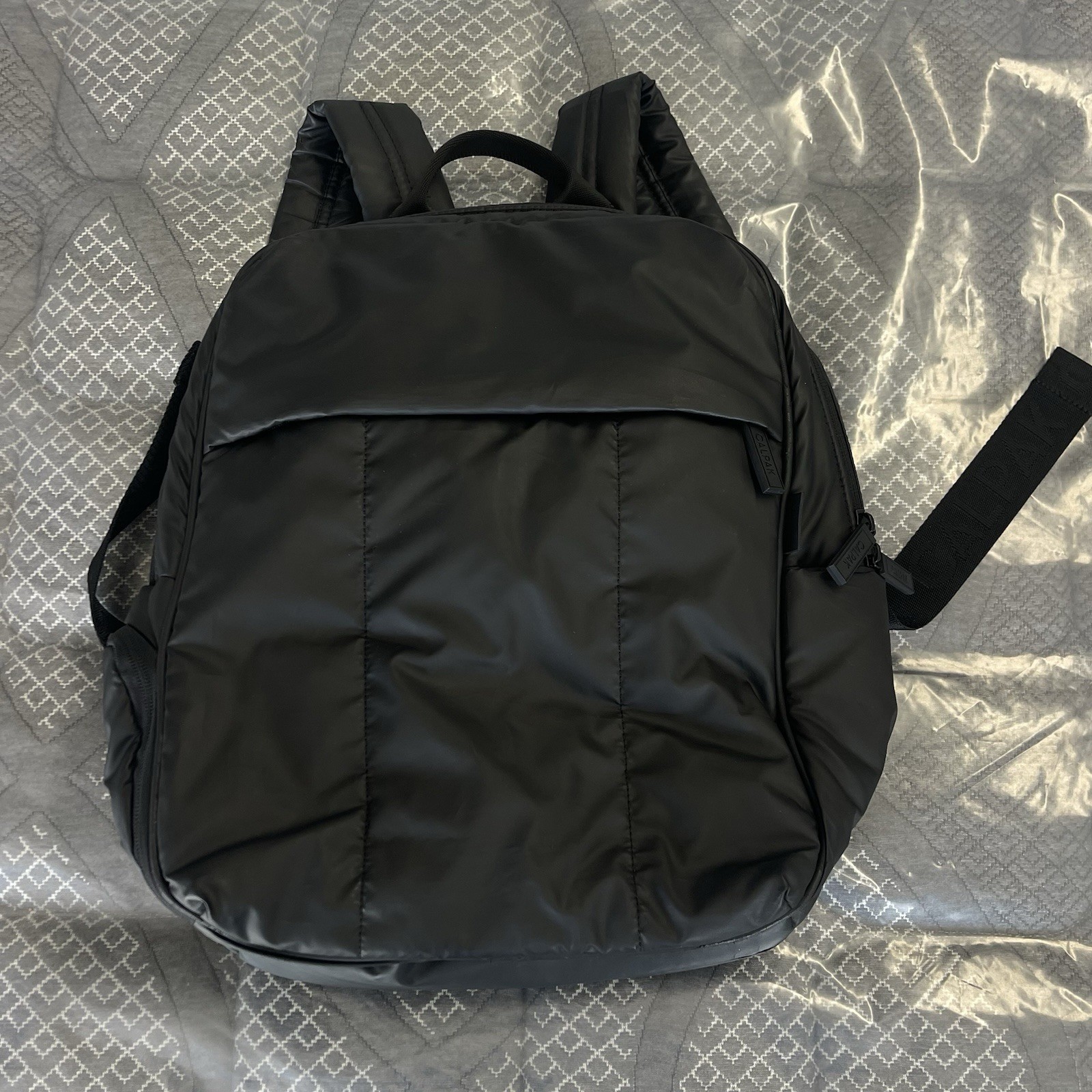CALPAK Luka 15" Laptop Backpack Matte Black Padded Adjustable Straps Polyester.