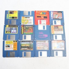 Commodore Amiga Plutos Game + 11 other Amiga Discs + Holder picture