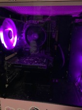 Pink PC build with rotating monitor and wired LED keyboard and mouse  picture