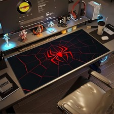 A Large Gaming Mouse Pad Featuring a Red And Black Spider Web Design with a Sp picture