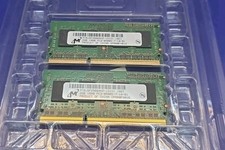 Two Micron MT8JSF25664HZ-1G1D1 2GB laptop memory modules. picture